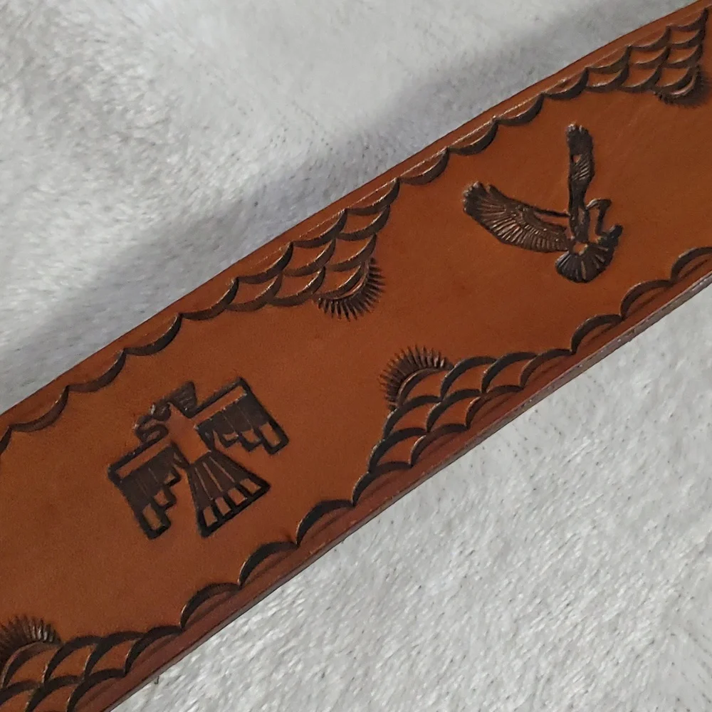 Vintage Leather Belt With Eagle Buckle and Details Embossed Along the Strap.